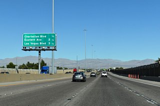 Interchange sequence sign posted beyond the Sahara Avenue underpass. Las Vegas Boulevard connects the freeway at Exit 75 with Downtown Las Vegas in 3.50 miles.