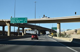 Rancho Drive meets I-11/U.S. 95 at Exit 77 in a half mile. Rancho Drive north is U.S. 95 Business/SR 595.