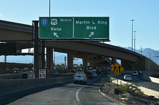 The entrance ramp from I-15/U.S. 95 south to I-11/U.S. 95 north includes access to Exit 77 C for MLK Boulevard.