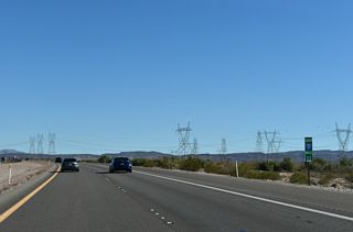A large array of transmission lines converge at the Mead Substation just south of Interstate 11.