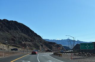 The diamond interchange at Exit 2 was modified to include a roundabout with connections to U.S. 93 Business west, SR 172 and Goldstrike Canyon Road. Traffic from U.S. 93 Business east ties into this ramp ahead of the roundabout to allow for free flow movement onto I-11 south.