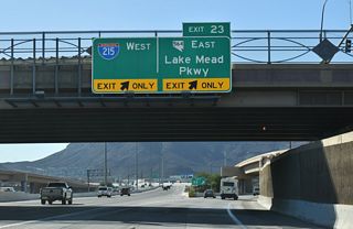 Exit 23 separates from I-11/U.S. 93-95 southbound below the Auto Show Drive over crossing.