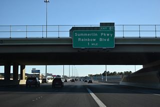 I-11/U.S. 95 south converges with parallel Rainbow Boulevard at the east end of Summerlin Parkway (SR 613) at Exit 81 in one mile.
