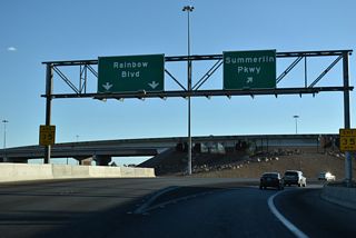 A directional T interchange connects I-11/U.S. 95 with SR 613 (Summerlin Parkway) west. That exchange overlays a SPUI with SR 595 (Rainbow Boulevard).
