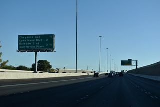 Interstate 11 advances a half mile south to Exit 83 for Cheyenne Avenue (former SR 574).