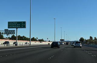The I-11/U.S. 95 mainline advances two miles south to Exit 85 for Craig Road (SR 573).