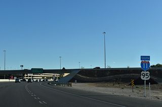 I-11/U.S. 95 southbound shields posted within the wye interchange where SR 599 (Rancho Drive) branches southeast.