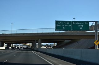 The exit for Centennial Center Boulevard and the Centennial Center retail complex separates from the c/d roadway for Exit 91 B below CC-215.