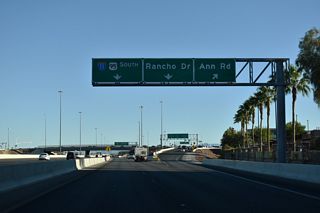 The entrance ramp from CC-215 east to I-11/U.S. 95 south joins the c/d roadway (Exit 91 B) for Ann Road and SR 595 (Rancho Drive) below the Azure Drive over crossing.