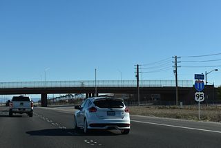 Grant Teton Drive spans I-11/U.S. 95 south beyond this reassurance shield assembly.