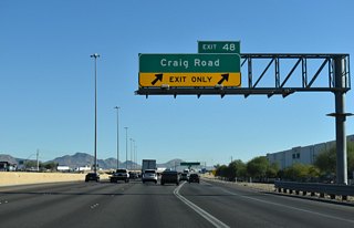 Two lanes leave I-15/U.S. 93 north at Exit 46 for Craig Road (SR 573).