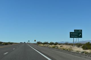 A folded diamond interchange (Exit 84) joins I-15 with Hidden Valley Road north to SR 168.