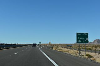 Carp Elgin Road extends north from Exit 100 across ranch lands and the Mormon Mountains into Lincoln County.