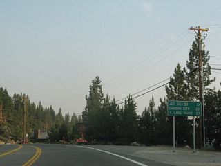 A mileage sign along Nevada 28 provides the distance to U.S. 50 (ten miles), Carson City (22 miles), and South Lake Tahoe (23 miles).