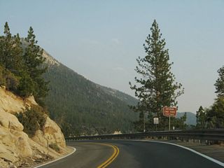 Nevada 28 east enters Lake Tahoe Nevada State Park. The park includes Sand Harbor, Memorial Point, Hidden Beach, Spooner Lake, and Cave Rock (along U.S. 50).