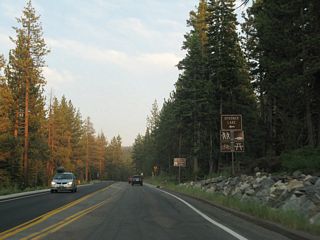Southbound Nevada 28 approaches the turnoff for Spooner Lake (left turn) in Lake Tahoe Nevada State Park.