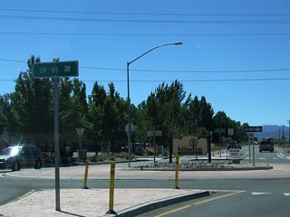 Southbound Nevada 88 meets Mahogany Drive and County Road at this roundabout intersection. The suggested speed for through traffic in the roundabout is 15 miles per hour. Note the town of Minden welcome sign is posted in the middle of the circle.