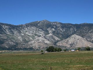 The towering peaks raise mightly above the agrarian landscape of the Carson Valley.