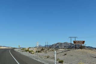 U.S. 93 curves northward into a broad valley between Las Vegas Range and Arrow Canyon Range.