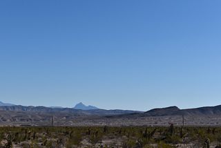 Mormon Peak appears beyond Arrow Canyon Range far to the east.
