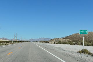 Kane Springs Road heads northeast across Kane Springs Valley to the ghost town of Elgin.