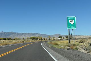 Curving east, northbound U.S. 93 meets SR 318 prior to leaving the Paharanagat Valley.