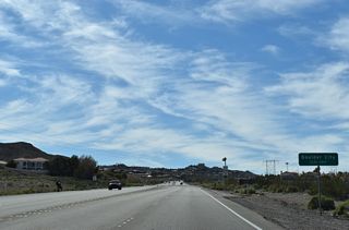 Leaving Lake Mead National Recreation Area, U.S. 93 Business enters the Boulder City limits.