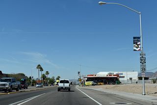 Reconstruction of Boulder City Parkway leading west from Nevada Way and Buchanan Boulevard by 2021 included landscaping and decorative street lamps. A U.S. 93 Business shield was added just past this former assembly.