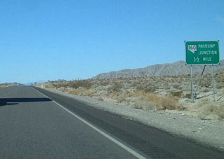 U.S. 95 turns southwest between the Specter Range and north end of the Spring Mountains before resuming west to meet the north end of SR 160 (Pahrump Valley Highway).