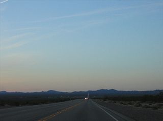 Prior to 2010, U.S. 95 was a two lane highway between SR 163 and U.S. 93 near Railroad Pass. The four lane highway has a median barrier in the rural segments and a center turn lane through Cal-Nev-Ari and Searchlight.