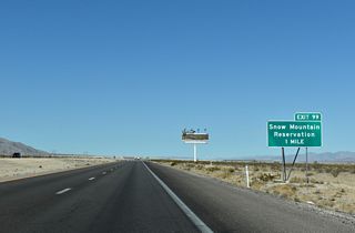 A diamond interchange joins U.S. 95 north with Pauite Way south and Nu-Wav Kaiv Boulevard east at Exit 99.