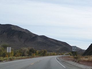 U.S. 95 (Veterans Memorial Highway) leaves Beatty south through the Amargosa Narrows west of Bare Mountain.