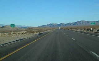 U.S. 95 leaves Nye County and enters Clark County ahead of the Indian Springs Valley.