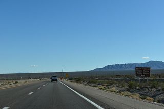 Corn Creek Road stems east toward the unincorporated community of Corn Creek and the Desert National Wildlife Refuge Visitor Center.