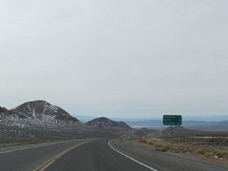 U.S. 95 leaves Nye County and reenters Esmeralda Count ahead of this distance sign posted 26 miles north of Goldfield.