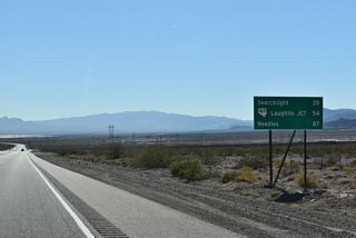 The previous distance sign posted south of I-11/U.S. 93 listed Cal Nev Ari at 47 miles. That entry was replaced with SR 163 / Laughlin Junction on a sign replacement made by 2022.