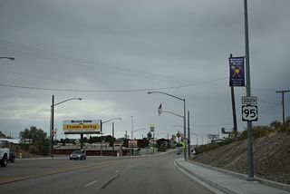 The speed limit is just 25 miles per hour by the array of motorist services along U.S. 95 in Searchlight.