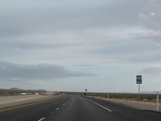 U.S. 95 expands into a divided highway south just ahead of Piute Wash.
