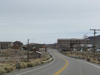 U.S. 95 curves southeast onto Crook Avenue ahead of the Goldfield business district.