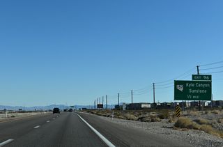 A DDI at Exit 96 joins U.S. 95 and Interstate 11 with the south end of SR 157 (Kyle Canyon Road).
