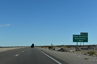 U.S. 95 upgrades to a freeway ahead of the diamond interchange (Exit 99) with Pauite Way south and Nu-Wav Kaiv Boulevard east.