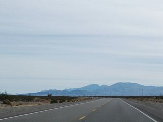 Curving southeast between the Amargosa Desert and Bare Mountain on U.S. 95 near Nye County milepost 54.
