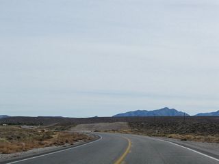 U.S. 95 (Veterans Memorial Highway) enters the Oasis Valley south ahead of the settlement of Springdale.