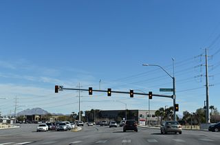 SR 146 curves northward from the traffic light with Coronado Center Drive.