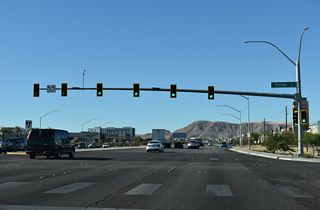 Amigo Street south intersects St. Rose Parkway across from Saint Rose Square shopping center.