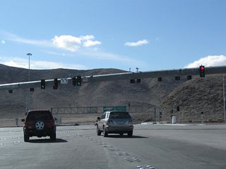 Two left turn lanes connect with the southbound entrance ramp for Interstate 15 to Primm, Barstow and Southern California.
