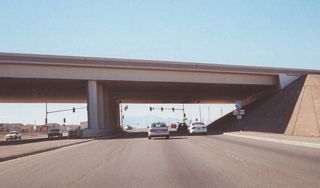The former section of SR 146 (Lake Mead Drive) between I-11 and Stephanie Street is all part of Interstate 215 today. Former SR 146 west (now SR 564 west) used to meet Interstate 515 at this overpass; today, this area is the location of the Interstate 11/215 interchange.