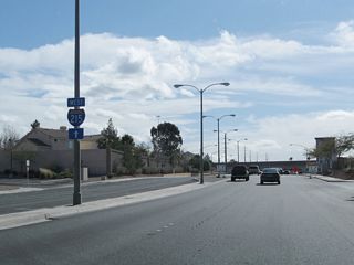 Traveling south on Pecos Road is this advance sign for the interchange with Interstate 215/Las Vegas (Bruce Woodbury) Beltway. To Interstate 215 west, stay right; to Interstate 215 east, stay left.