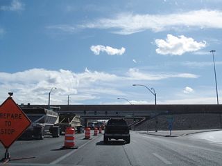Southbound Pecos Road meets Interstate 215/Las Vegas (Bruce Woodbury) Beltway west, which travels west to Las Vegas Boulevard, Interstate 15, and all points in the west valley (including Summerlin) via Clark County Route 215.