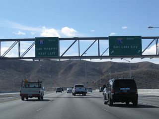 After the Las Vegas Boulevard intersection, westbound Nevada 146 approaches its interchange with Interstate 15 (a single-point, urban interchange or SPUI). The next right connects to Interstate 15 north to downtown Las Vegas, Mesquite, St. George, and Salt Lake City. Stay left for Interstate 15 south to Barstow and Los Angeles.
